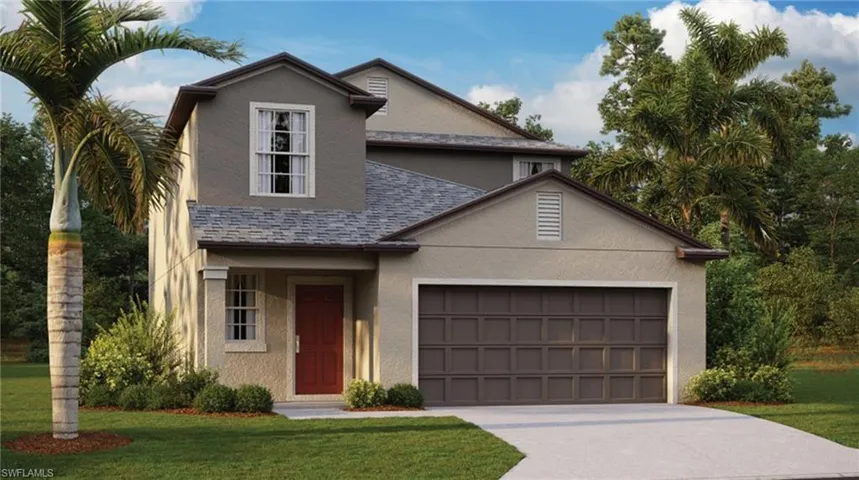 View of property featuring a garage and a front lawn