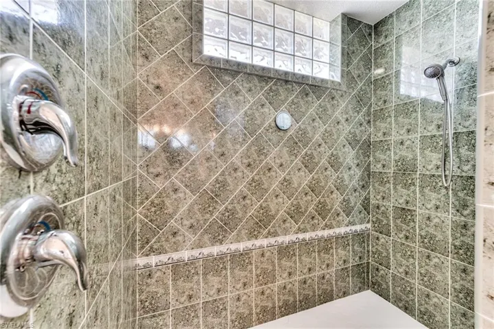 Bathroom featuring tiled shower
