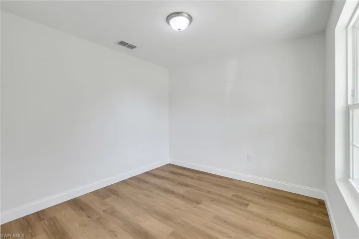 Empty room with light wood-type flooring