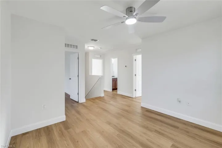 Unfurnished room featuring ceiling fan and light hardwood / wood-style floors