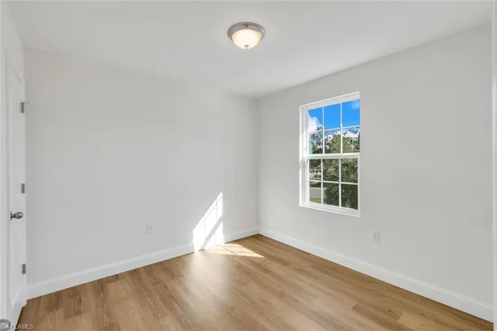 Empty room featuring light wood-type flooring