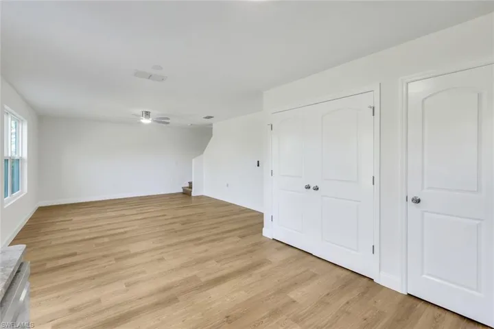 Unfurnished living room with light wood-type flooring