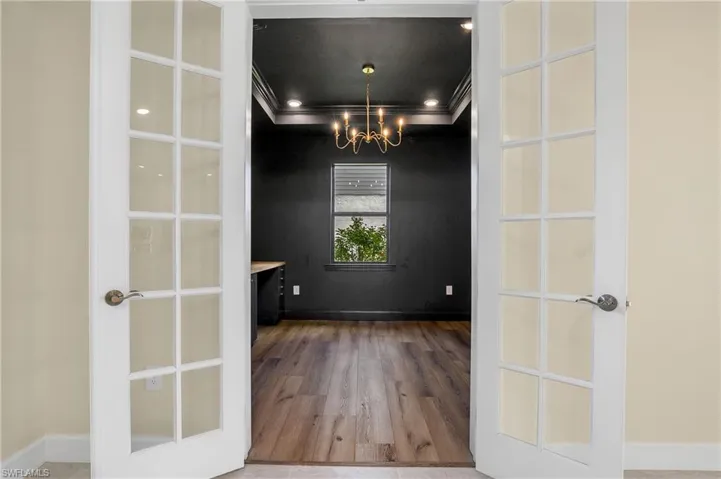 Moody office or den with built in double desk.