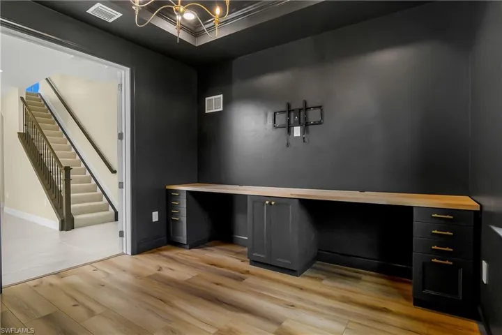 Office or Den with wide plank wood floor