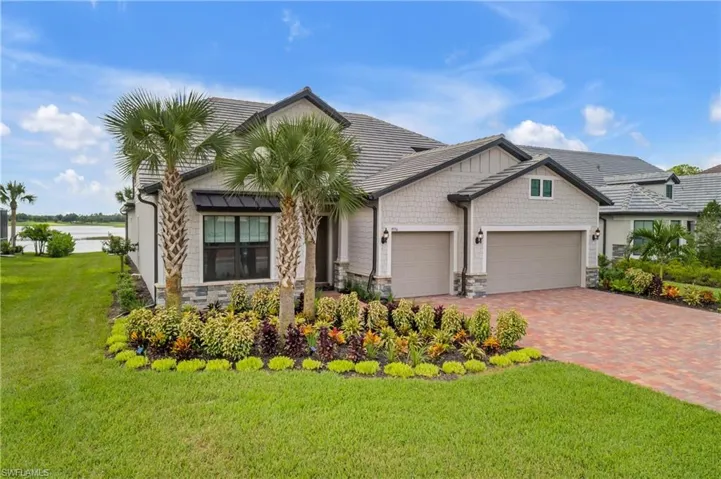 View of front facade with a garage and a front yard