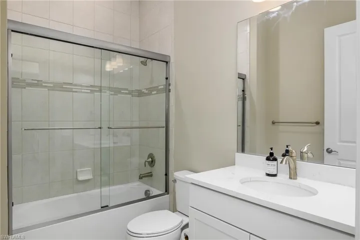 Full bathroom with shower / bath combination next to bedroom 3