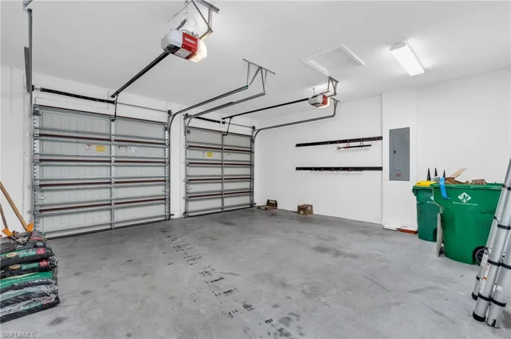Garage with a garage door opener and electric panel