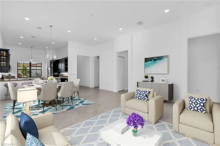 Tiled living room with a notable chandelier