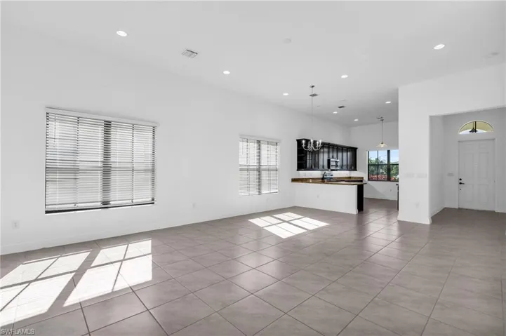 Unfurnished living room with light tile patterned flooring