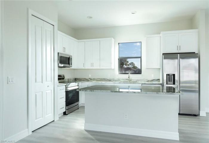 Kitchen Window, Granite/ Moen fixtures throughout