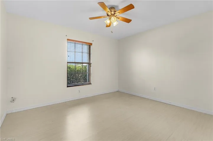 Unfurnished room with light hardwood / wood-style flooring and ceiling fan