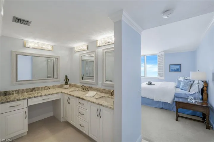 Master Bathroom with vanity and view into Master Bedroom