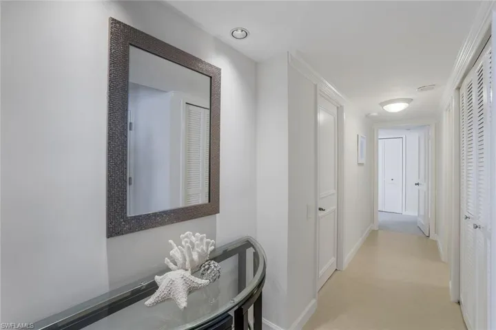 Foyer, looking towards guest suites. Split bedrooms from the Master Suite offering privacy.