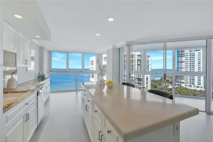 Bright kitchen with spectacular views of the beach and Gulf.