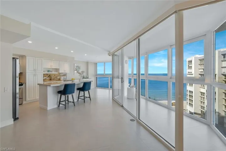 Enclosed balcony with #1 option to use as an "outdoor" lanai with top windows opening to let in fresh air, or keep windows closed and open sliders to have space air conditioned.Best of both worlds.