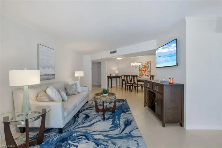 Open floor plan. Living room with crown molding.
