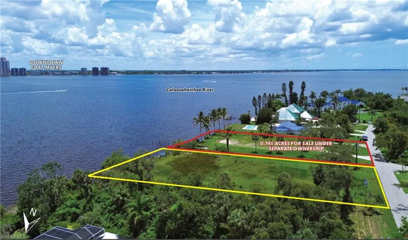 View of property location with a large body of water and property boundaries highlighted