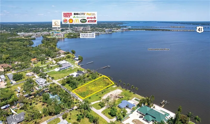 Aerial view of property's location featuring a nearby body of water and property boundaries highlighted