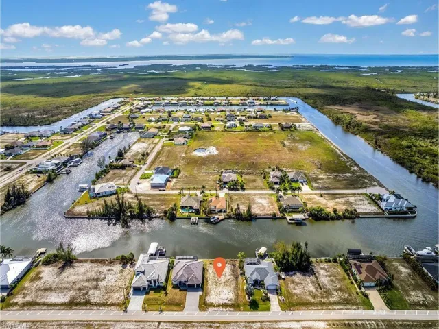 Aerial perspective of suburban area with a large body of water