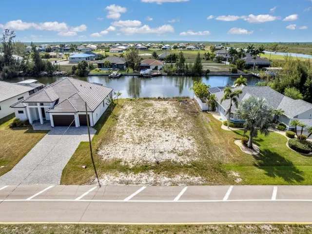 Aerial view of residential area with a large body of water