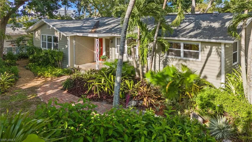 Bungalow wrapped in plants, walkways
