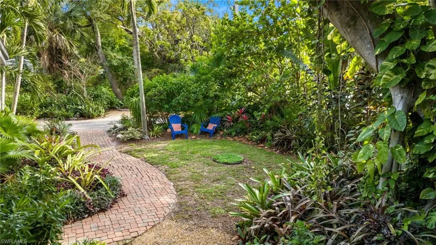 Graceful paver walkway to front door of Bungalow