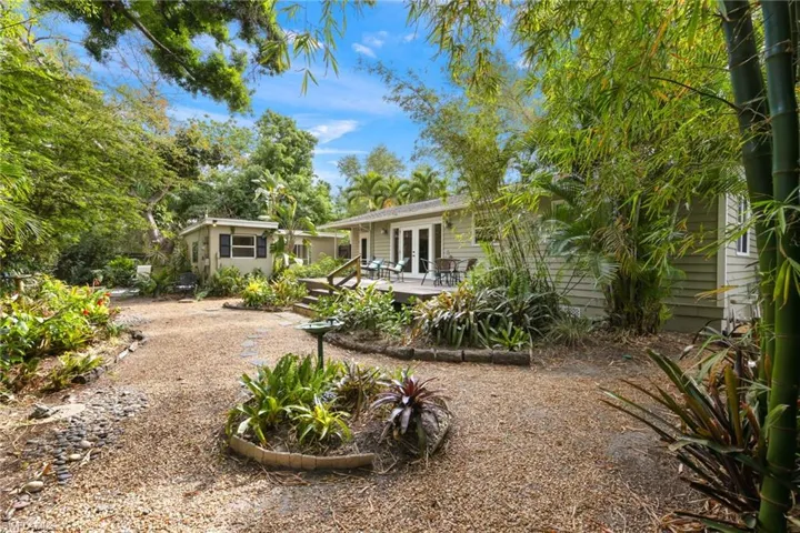 Broad pebble paths show Bungalow at center, Casita to L