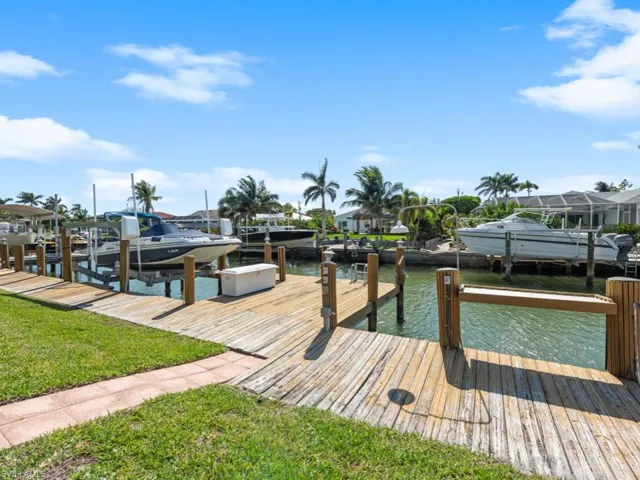 Dock area featuring a water view and boat lift