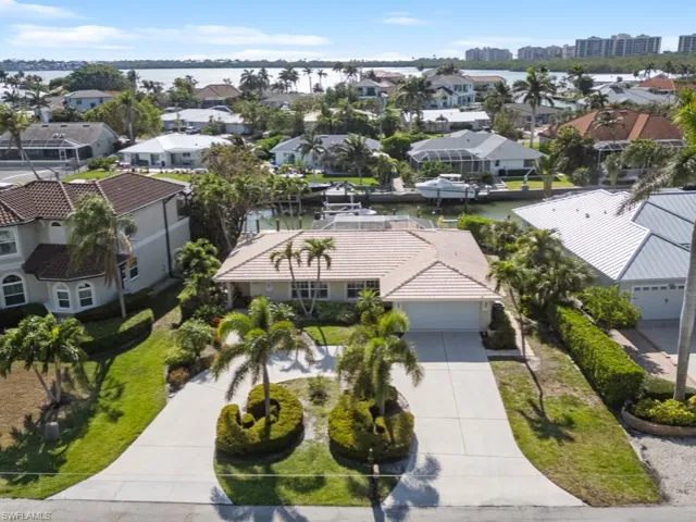 Drone / aerial view featuring a water view and a residential view