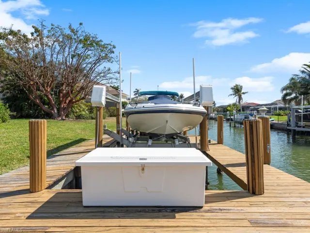 Dock area featuring a water view and boat lift