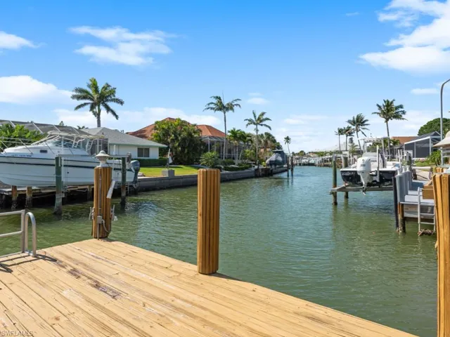 Dock area featuring a water view and boat lift