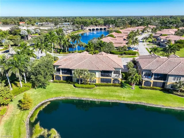 Drone / aerial view of a large body of water and a tree filled landscape