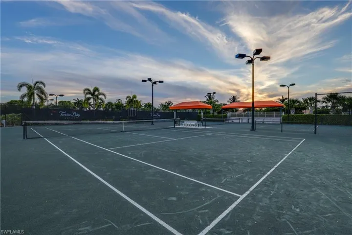 View of tennis court featuring community basketball court
