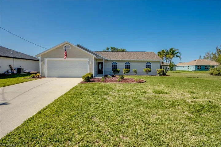 Beautiful single-story home featuring a 2-car garage and a gorgeous, freshly updated front yard.