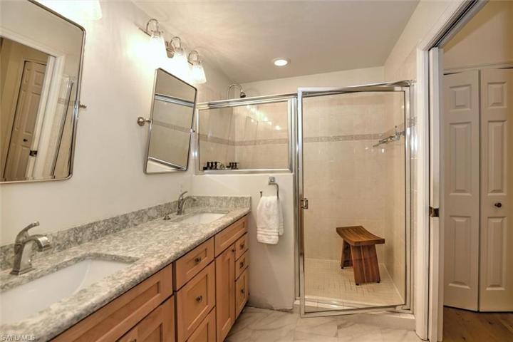 Master bathroom w/tiled, glass enclosed shower, new double maple vanity & custom granite countertop!