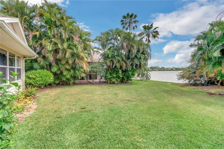 View of yard with a water view