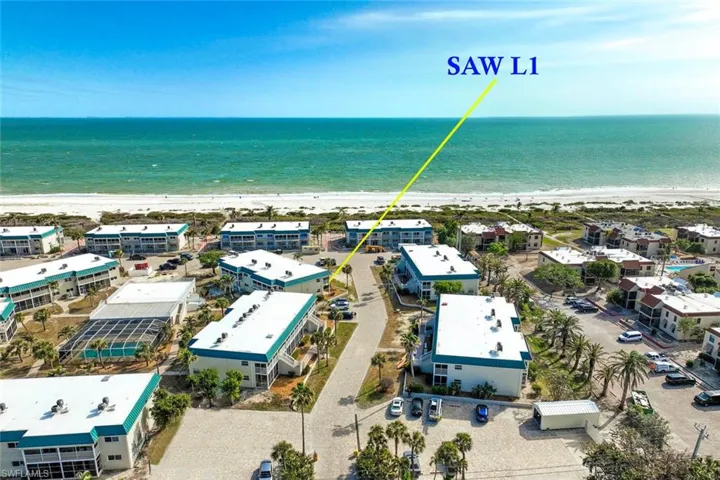 Aerial view with a water view and a beach view