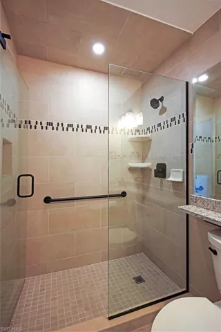 Bathroom with an enclosed shower and toilet