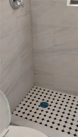 Bathroom featuring a shower stall
