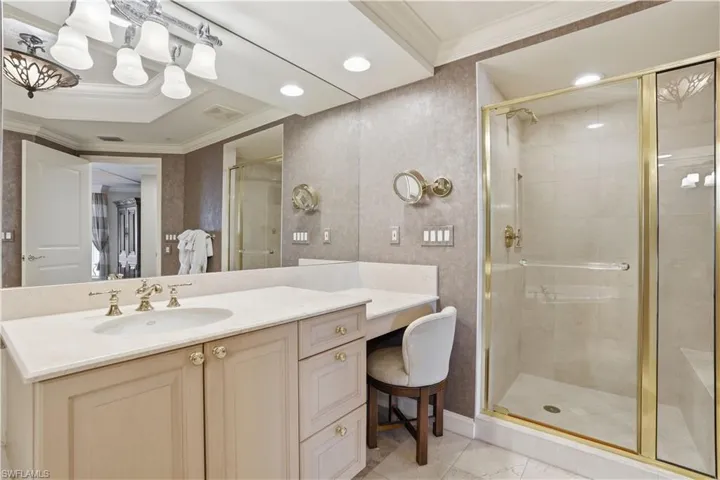 The primary bathroom features two separate sink/vanity areas, a walk in shower, a soaking tub and a  private water closetl