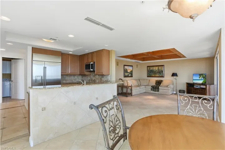 View of living, kitchen and breakfast area from west end of unit.