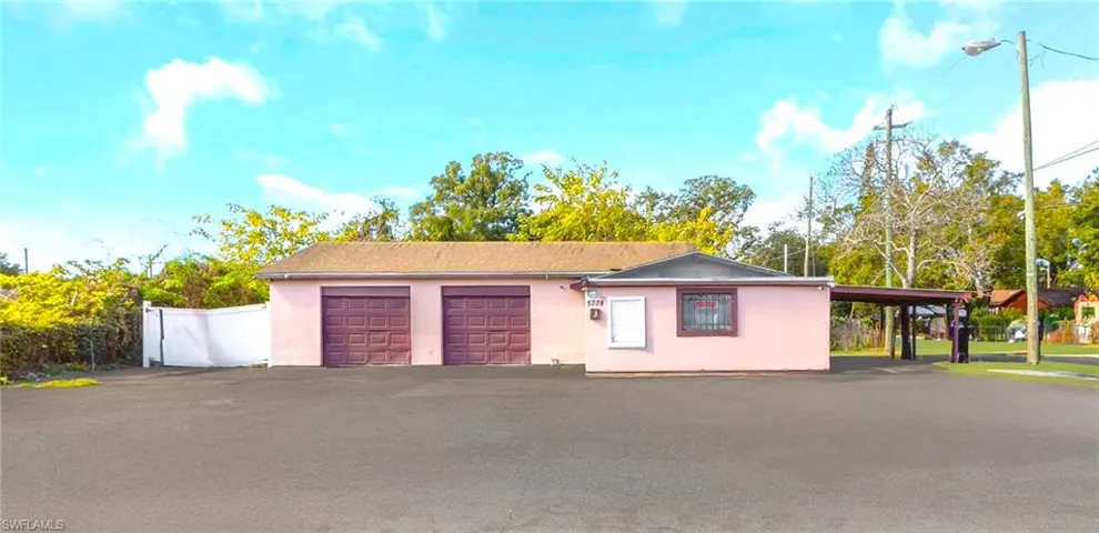 Garage with asphalt driveway