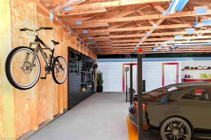 Garage featuring wooden walls