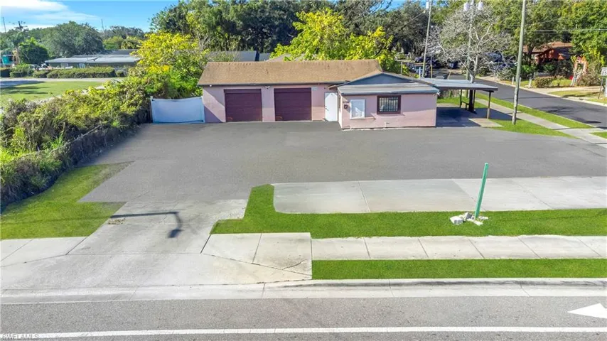 Single story home featuring stucco siding, driveway, and an attached garage