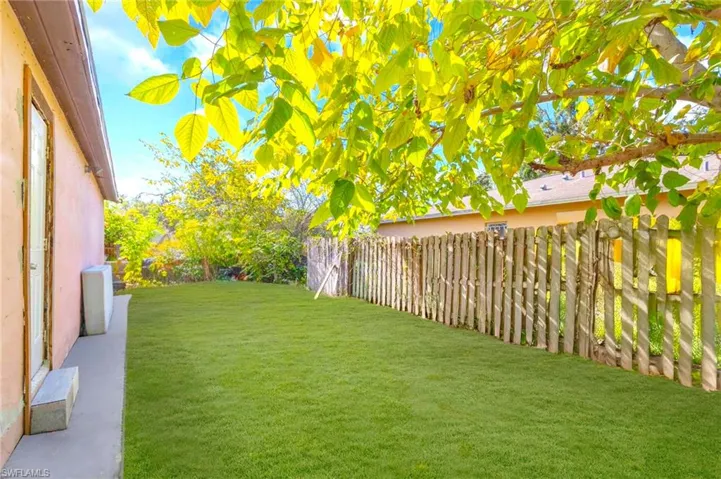 View of fenced backyard