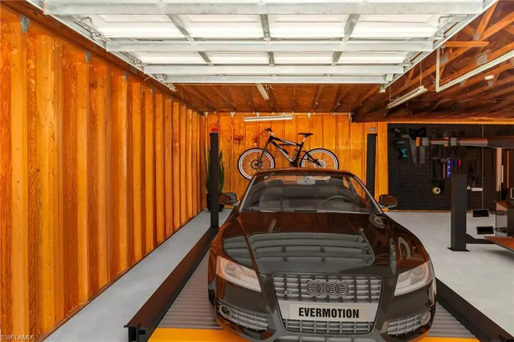 Garage featuring wooden walls