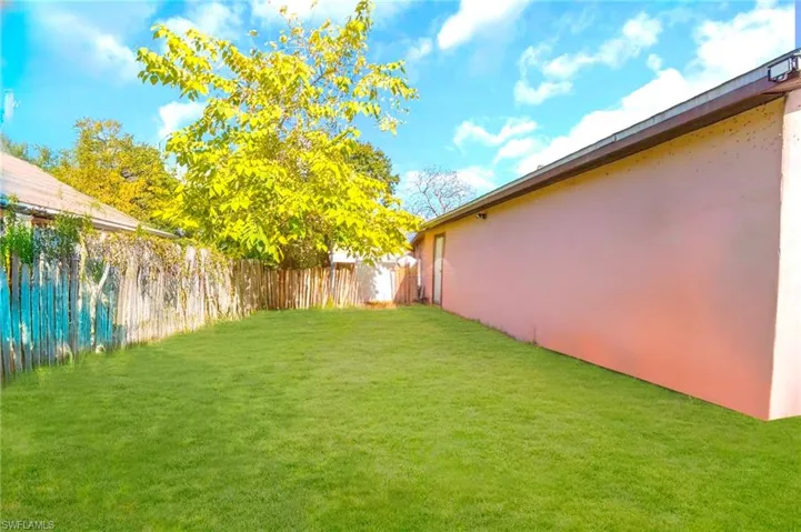 View of fenced backyard