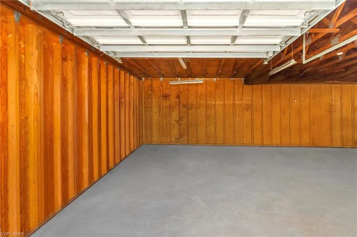 Garage featuring wood walls