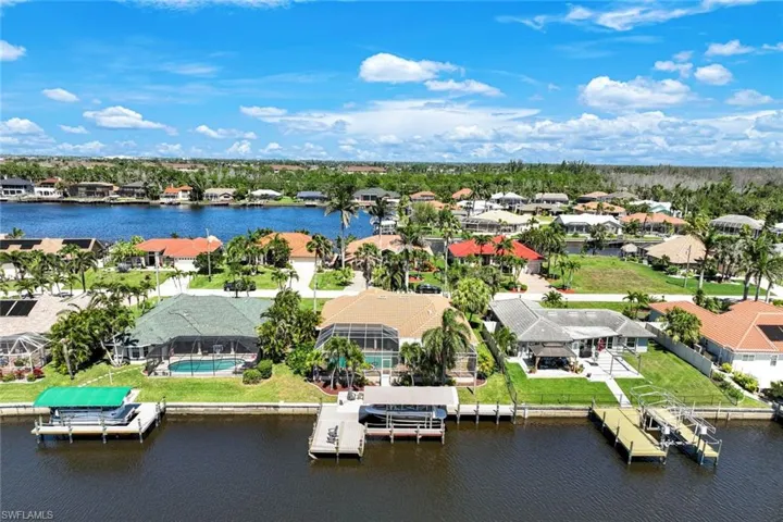 Drone / aerial view featuring a residential view and a water view