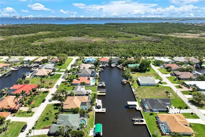 Drone / aerial view with a water view and a residential view